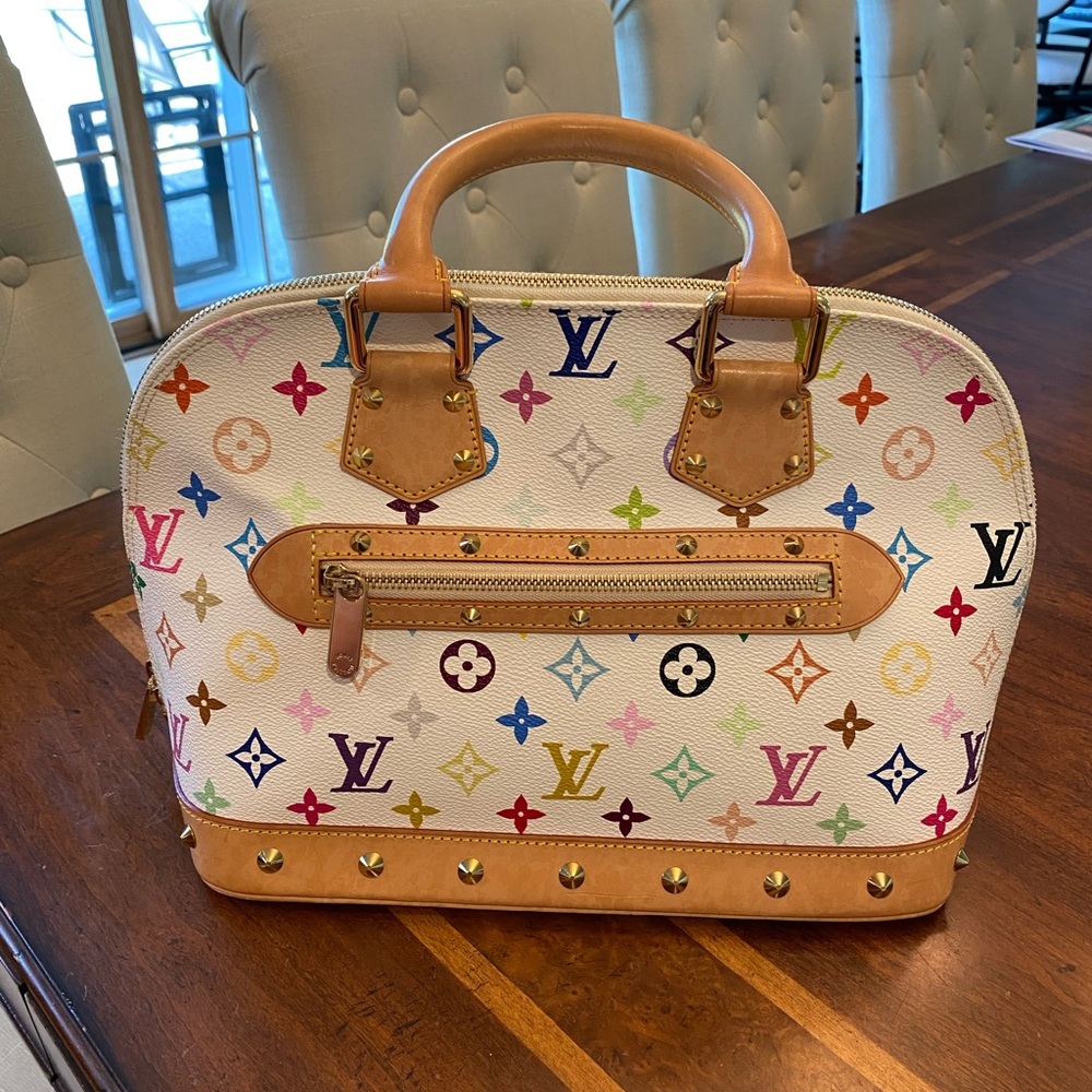 Authentic Louis Vuitton Alma handbag. White w. color monogram. Limited Edition.